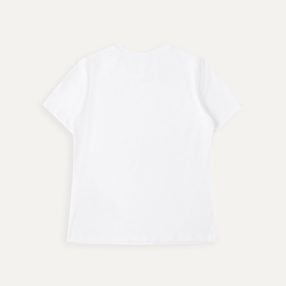 Plain white t-shirt on a light beige background
